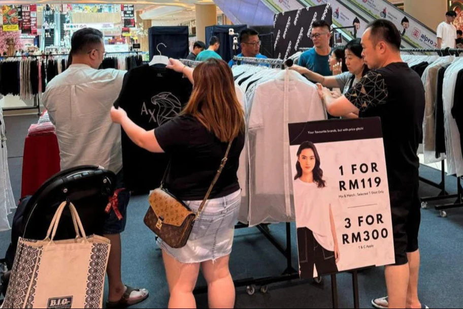 Shoppers' exploring racks at our pop‑up event